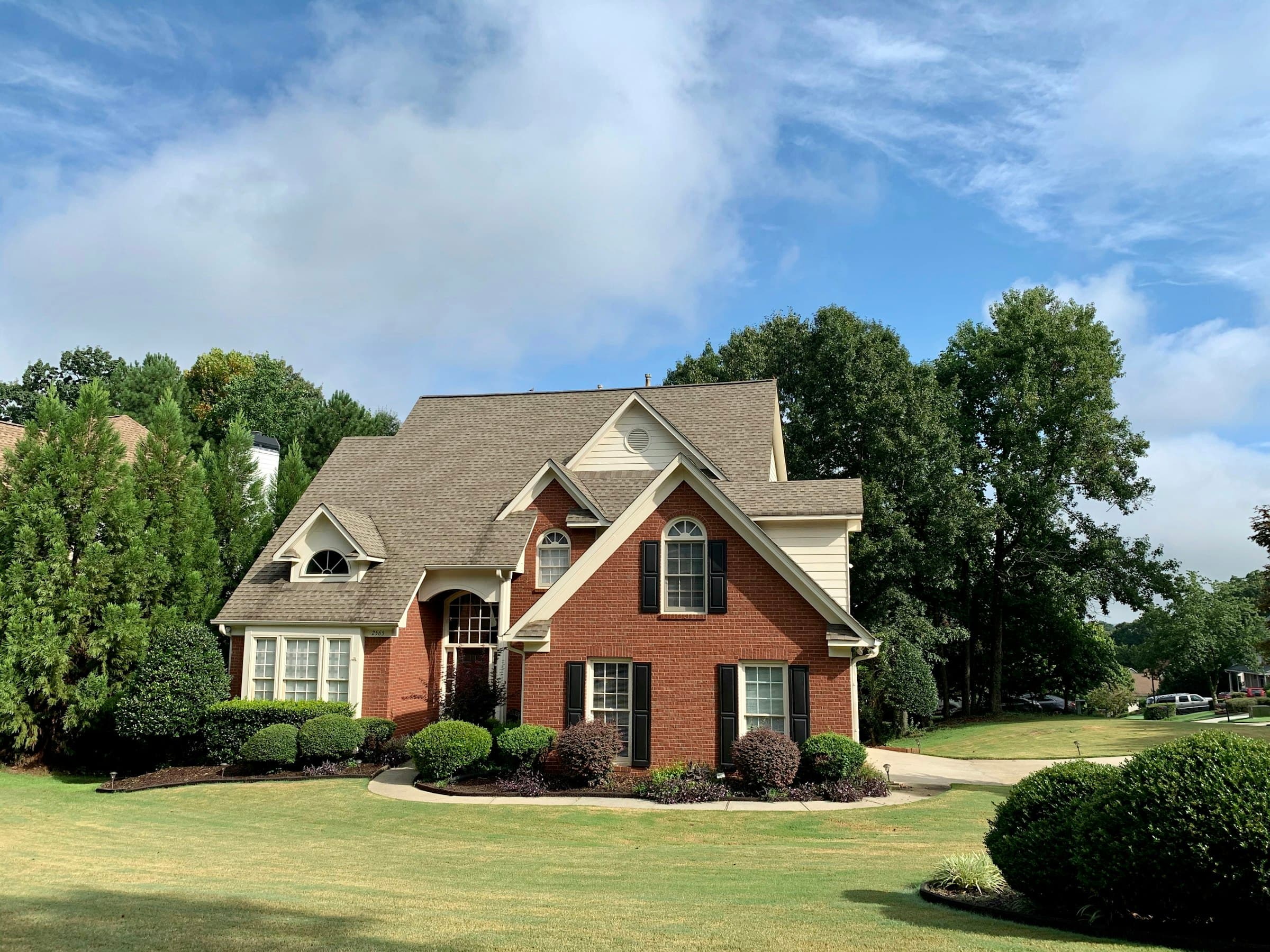 Suburban home with manicured landscaping and a clean front yard